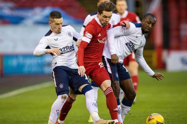 Scott Wright tussles with future team-mates Ryan Kent and Glen Kamara during the Premiership clash between Aberdeen and Rangers at Pittodrie on January 10. (Photo by Craig Williamson / SNS Group)