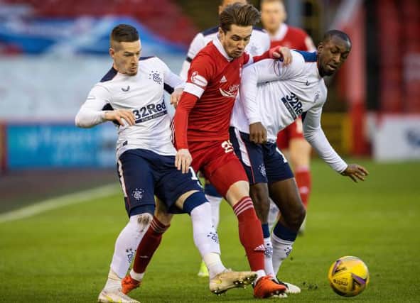 Scott Wright tussles with future team-mates Ryan Kent and Glen Kamara during the Premiership clash between Aberdeen and Rangers at Pittodrie on January 10. (Photo by Craig Williamson / SNS Group)