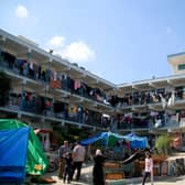 Displaced Palestinian citizens gather at the UNRWA (United Nations Relief and Works Agency for Palestine Refugees) school in Khan Yunis, after evacuating their homes that were damaged by Israeli airstrikes earlier this month.