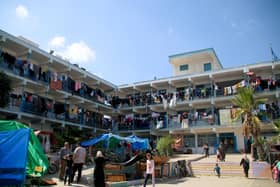 Displaced Palestinian citizens gather at the UNRWA (United Nations Relief and Works Agency for Palestine Refugees) school in Khan Yunis, after evacuating their homes that were damaged by Israeli airstrikes earlier this month.