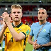 Nathaniel Atkinson of Australia celebrates after their sides victory during the 2022 FIFA World Cup Playoff match between United Arab Emirates and Australia at Ahmad Bin Ali Stadium on June 07, 2022 in Doha, Qatar. (Photo by Mohamed Farag/Getty Images)