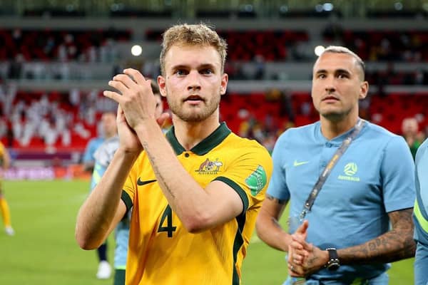 Nathaniel Atkinson of Australia celebrates after their sides victory during the 2022 FIFA World Cup Playoff match between United Arab Emirates and Australia at Ahmad Bin Ali Stadium on June 07, 2022 in Doha, Qatar. (Photo by Mohamed Farag/Getty Images)