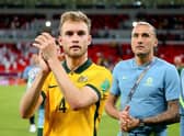 Nathaniel Atkinson of Australia celebrates after their sides victory during the 2022 FIFA World Cup Playoff match between United Arab Emirates and Australia at Ahmad Bin Ali Stadium on June 07, 2022 in Doha, Qatar. (Photo by Mohamed Farag/Getty Images)