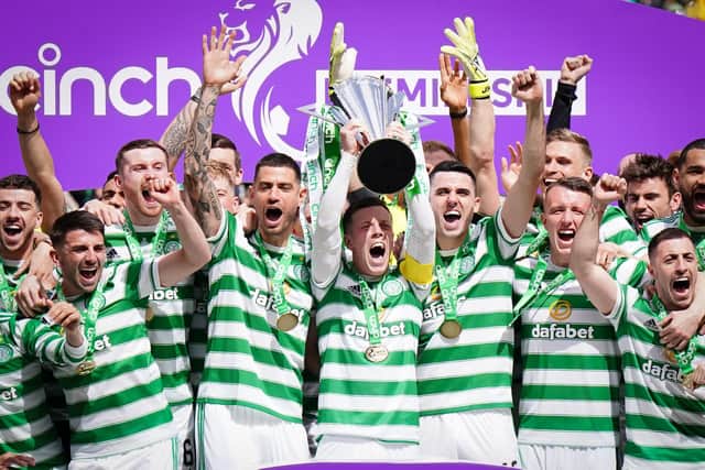 Celtic celebrate with the league trophy after the cinch Premiership match at Celtic Park, Glasgow. Picture date: Saturday May 14, 2022.