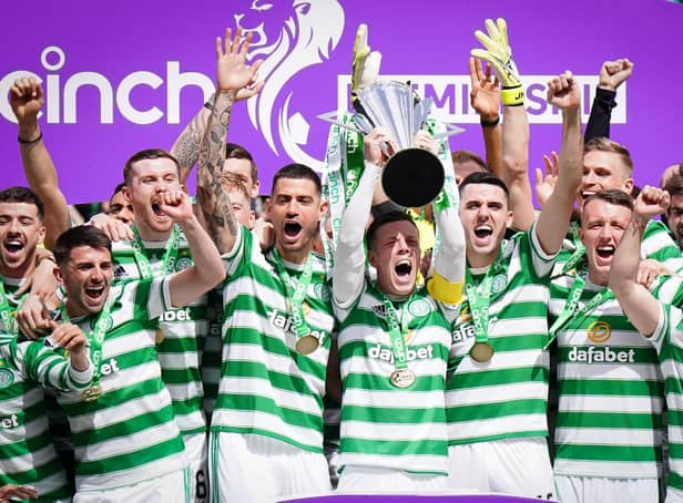 Celtic celebrate with the league trophy after the cinch Premiership match at Celtic Park, Glasgow. Picture date: Saturday May 14, 2022.