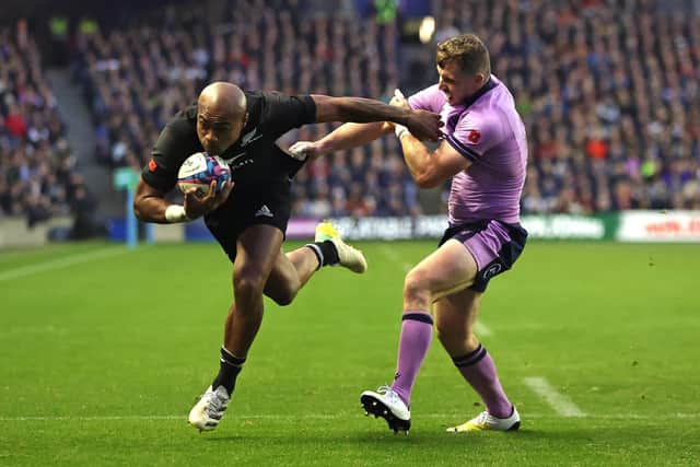 Mark Telea scores New Zealand's fourth try to put the game beyond Scotland. (Photo by David Rogers/Getty Images)