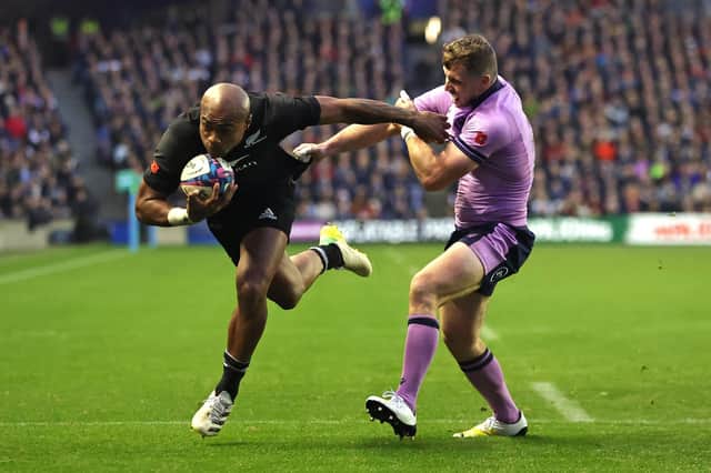 Mark Telea scores New Zealand's fourth try to put the game beyond Scotland. (Photo by David Rogers/Getty Images)