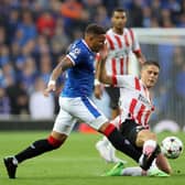 Rangers' James Tavernier and PSV Eindhoven's Joey Veerman battle for the ball during the Champions League qualifying match at Ibrox. (Steve Welsh/PA Wire)