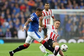 Rangers' James Tavernier and PSV Eindhoven's Joey Veerman battle for the ball during the Champions League qualifying match at Ibrox. (Steve Welsh/PA Wire)