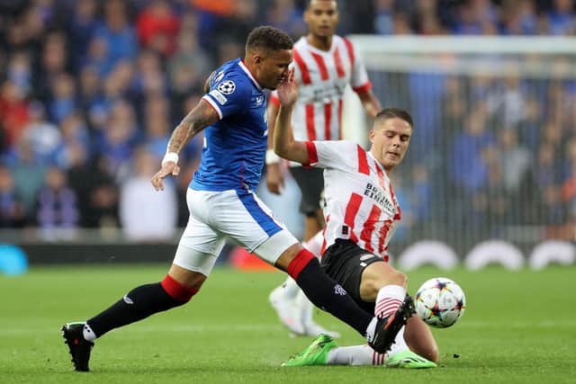 Rangers' James Tavernier and PSV Eindhoven's Joey Veerman battle for the ball during the Champions League qualifying match at Ibrox. (Steve Welsh/PA Wire)