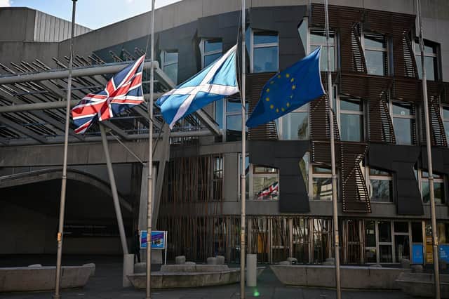 Flags fly at half mast outside the Scottish Parliament in Edinburgh to mark the death of the Duke Of Edinburgh. (Photo by Jeff J Mitchell/Getty Images)