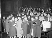 Hogmanay revellers at Tron Kirk Edinburgh 1959