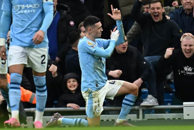 Manchester City's English midfielder Phil Foden celebrates.