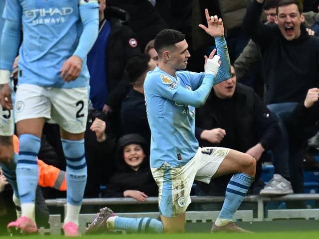 Manchester City's English midfielder Phil Foden celebrates.