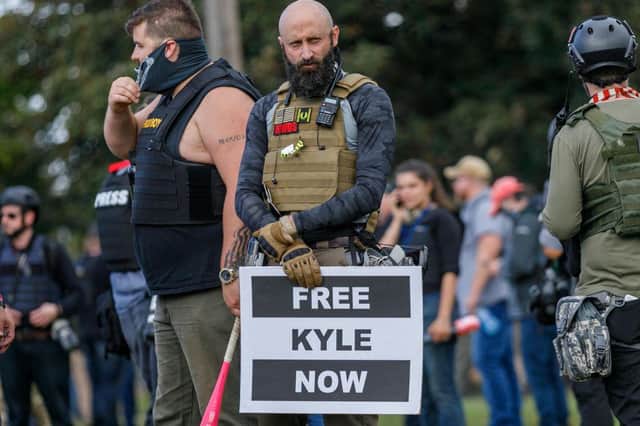 A Proud Boys member shows support for Kenosha shooter Kyle Rittenhouse at a gathering in Portland, Oregon (Getty Images)
