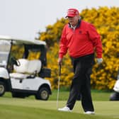 Former US president Donald Trump playing golf at  his Turnberry course. Picture: Andrew Milligan/PA Wire