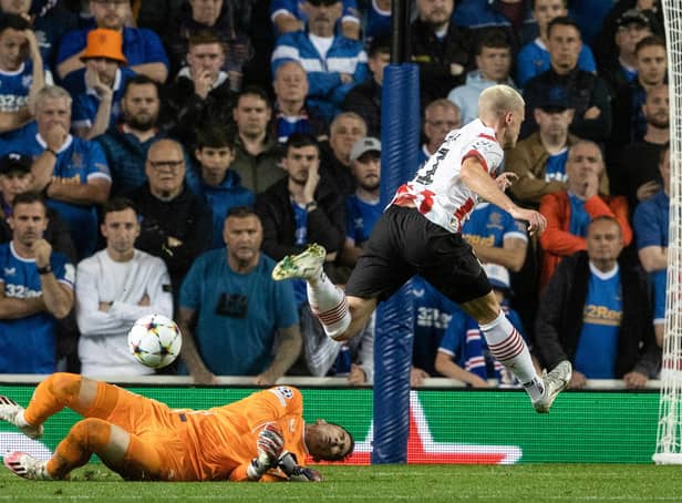 Jon McLaughlin (L) saves at the feet of PSV's Philipp Max during Tuesday night's 2-2 Champions League play-off draw with PSV  (Photo by Alan Harvey / SNS Group)