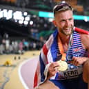 Edinburgh's Josh Kerr celebrates with his gold medal after winning the men's 1500m final at World Athletics Championships in Budapest. (Photo by KIRILL KUDRYAVTSEV/AFP via Getty Images)
