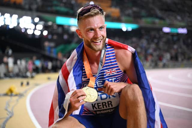 Edinburgh's Josh Kerr celebrates with his gold medal after winning the men's 1500m final at World Athletics Championships in Budapest. (Photo by KIRILL KUDRYAVTSEV/AFP via Getty Images)