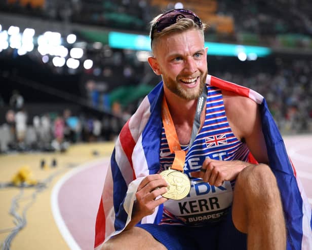 Edinburgh's Josh Kerr celebrates with his gold medal after winning the men's 1500m final at World Athletics Championships in Budapest. (Photo by KIRILL KUDRYAVTSEV/AFP via Getty Images)