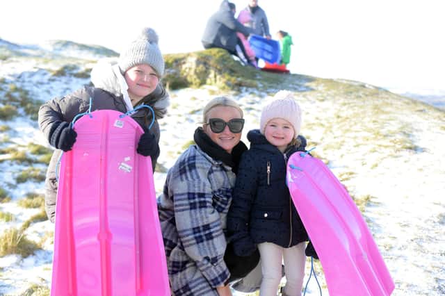 Sledging on Cleadon Hills. Kayleigh Scott with daughters Tilly, ten and Elle, three.