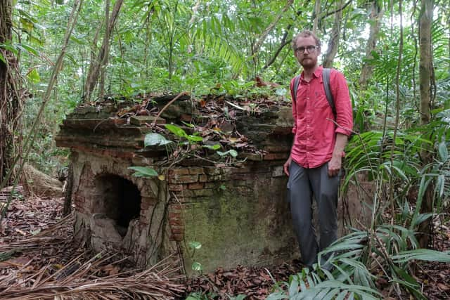 Researcher Michael Hopcroft at the tomb which was tended by Sir James' slaves after his death.