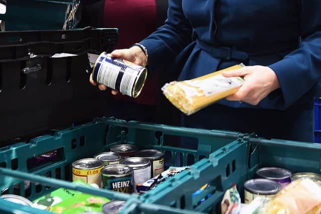 The five-week wait to receive Universal Credit is one reason why recipients get into debt and are forced to use charity food banks (Picture: Andy Buchanan/PA)