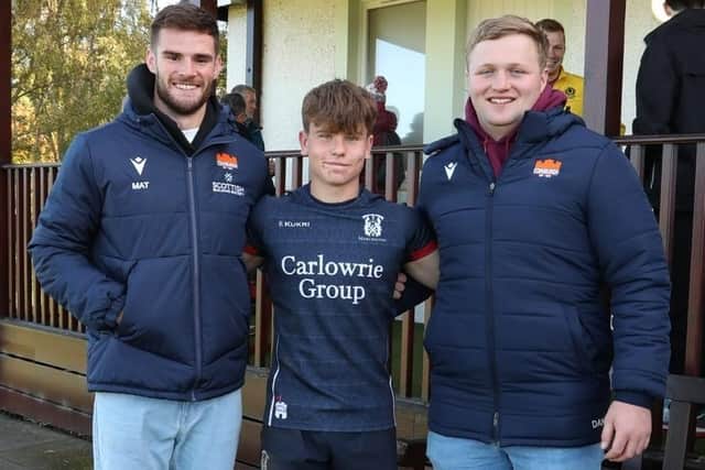 Isaac Coates, player of the under-18 National Rugby Festival, with Edinburgh Rugby's Matt Currie and Dan Gamble.