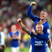 Scott Arfield and John Lundstram celebrate Rangers return to the Champions League.