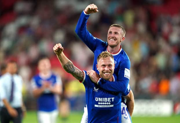 Scott Arfield and John Lundstram celebrate Rangers return to the Champions League.