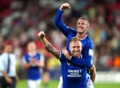 Scott Arfield and John Lundstram celebrate Rangers return to the Champions League.