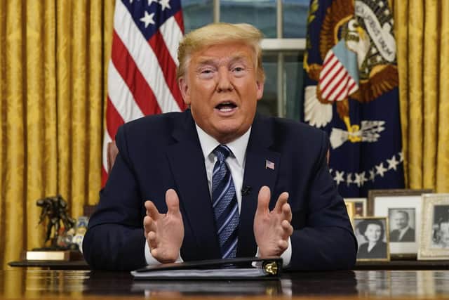 President Donald Trump speaks in an address to the nation from the Oval Office at the White House about the coronaviru. (Doug Mills/The New York Times via AP, Pool)