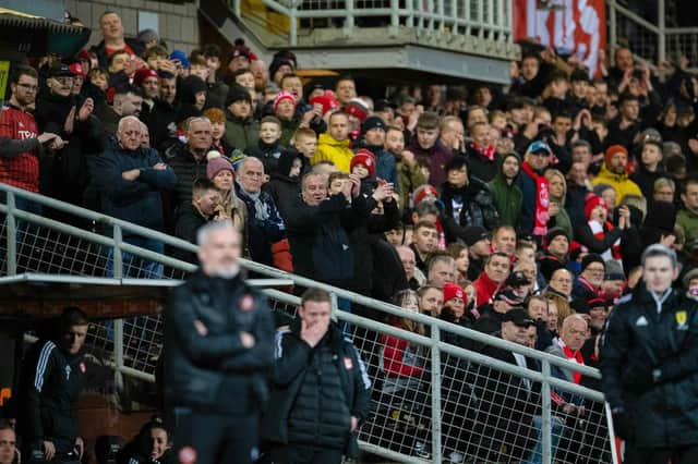 Barry Robson (background) was the happier manager - in his case, interim manager - as Aberdeen beat Jim Goodwin's Dundee United 3-1 at Tannadice.  (Photo by Mark Scates / SNS Group)