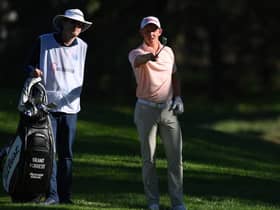 Grant Forrest talks through a shot with caddie John McClure during the Open de Espana at Club de Campo Villa de Madrid. Picture: Stuart Franklin/Getty Images.