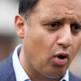 Scottish Labour leader Anas Sarwar speaks to the media after himself and Scottish Labour candidate for Rutherglen and Hamilton West Michael Shanks unveiled a billboard on their party's plan to make work pay in Cambuslang.