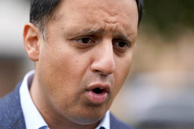 Scottish Labour leader Anas Sarwar speaks to the media after himself and Scottish Labour candidate for Rutherglen and Hamilton West Michael Shanks unveiled a billboard on their party's plan to make work pay in Cambuslang.