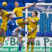 St Johnstone's Guy Melamed (L-R), Hibs' Paul McGinn, St Johnstone's Callum Booth, and Hibs' Ryan Porteous and Paul Hanlon in action during the league clash at McDiarmid Park. Photo by Alan Harvey / SNS Group