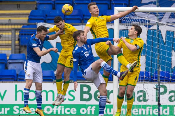 St Johnstone's Guy Melamed (L-R), Hibs' Paul McGinn, St Johnstone's Callum Booth, and Hibs' Ryan Porteous and Paul Hanlon in action during the league clash at McDiarmid Park. Photo by Alan Harvey / SNS Group