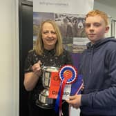 Finlay Hunter receiving the Calladrum Cup from sponsor Hazel Moir