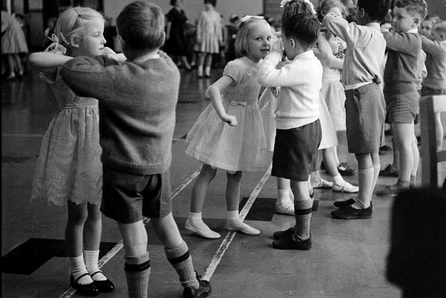 Children enjoy a dance at Parsons Green School infants Christmas party in Edinburgh in 1962.