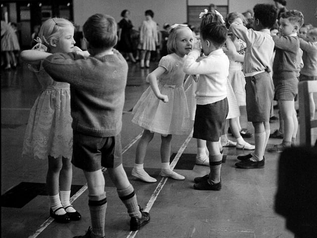 Children enjoy a dance at Parsons Green School infants Christmas party in Edinburgh in 1962.