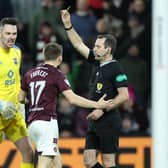 Alan Forrest was booked for simulation during Hearts' 2-2 draw against Ross County.