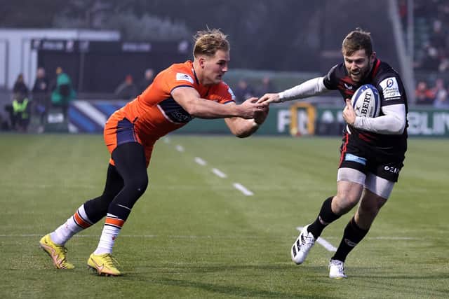 Player of the match Elliot Daly gets away from Duhan van der Merwe to score Saracens' first try against Edinburgh at StoneX Stadium. (Photo by David Rogers/Getty Images)