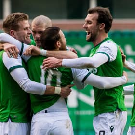 Hibs players swarm matchwinner Martin Boyle as they moved five points ahead of their main rivals, Aberdeen, in the chase for third place. Photo by Ross Parker / SNS Group
