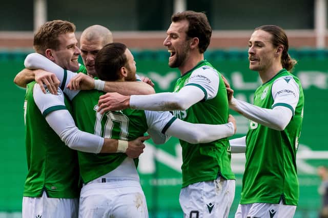 Hibs players swarm matchwinner Martin Boyle as they moved five points ahead of their main rivals, Aberdeen, in the chase for third place. Photo by Ross Parker / SNS Group