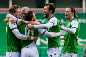 Hibs players swarm matchwinner Martin Boyle as they moved five points ahead of their main rivals, Aberdeen, in the chase for third place. Photo by Ross Parker / SNS Group