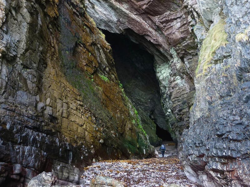 Said to be the deepest Hebridean sea cave at 500ft, MacKinnon’s Cave rests on the Isle of Mull’s west coast near Gribun. The early Celtic monk, Abbot MacKinnon, was supposedly concealed there in the 15th century. Deep within the cave, explorers can find a large, flat rock slab known as “Fingal’s Table” which was reputedly used as an altar by early followers of the Christian church. MacKinnon’s Cave is also infamous in local folklore as a site where murderous fairies dwell.