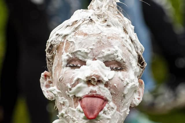 Hundreds of students take part in the traditional Raisin Monday foam fight on St Salvator's Lower College Lawn at the University of St Andrews in Fife (Photo: Lisa Ferguson).