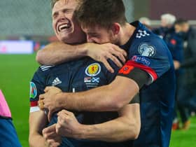 Declan Gallagher (right) drapes himself round Scott McTominay as the pair get lost in the elation of Scotland's penalty-shoot progress to a first major finals in 23 years (Photo by Nikola Krstic / SNS Group)