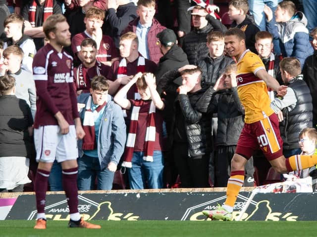 Joe Efford celebrates opening the scoring for Motherwell against Hearts.